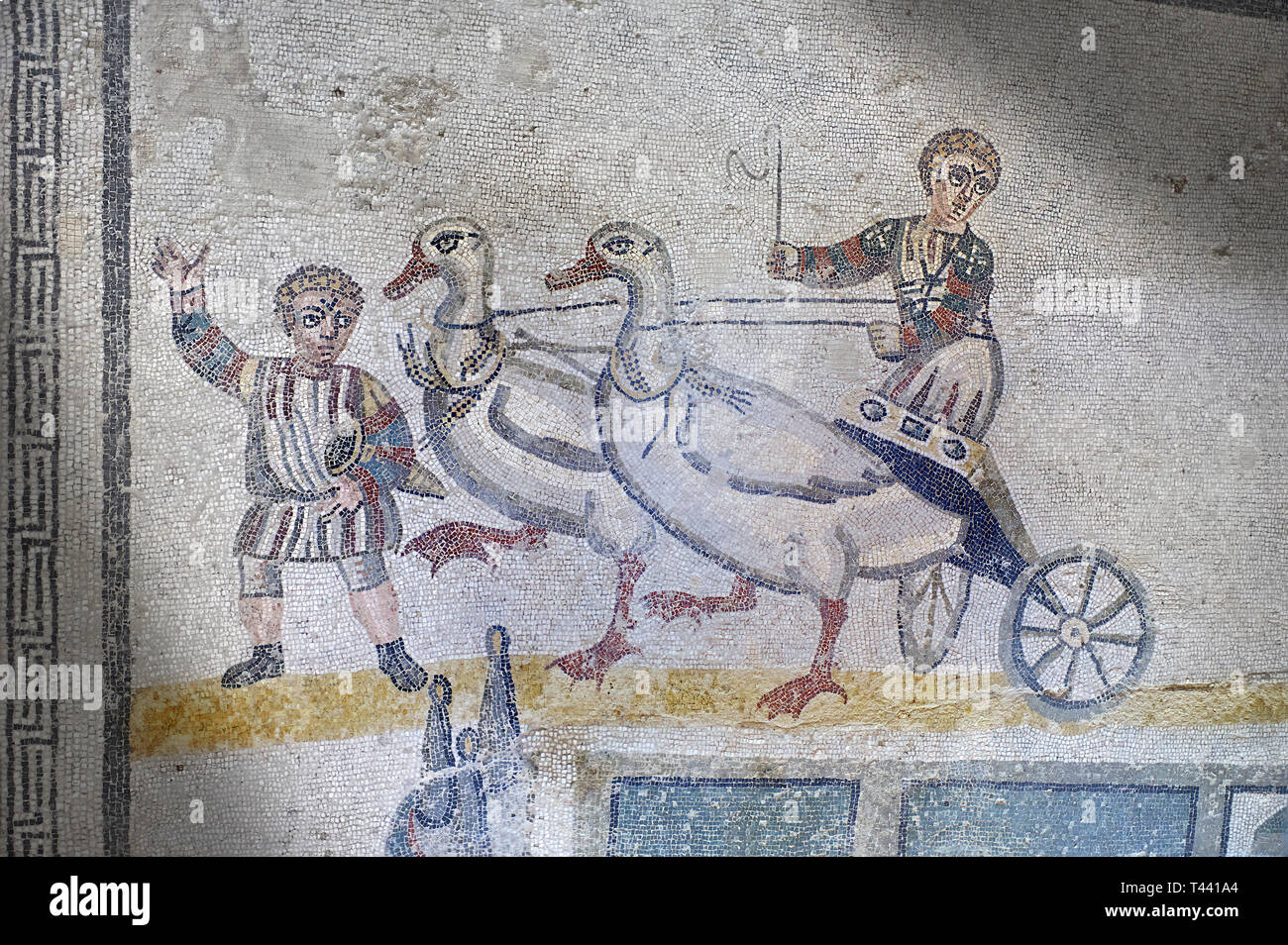 Close up picture of the Roman mosaics of the room of the Small Circus depicting Roman boys riding small chariots pulled by geese in a small circus, Th Stock Photo
