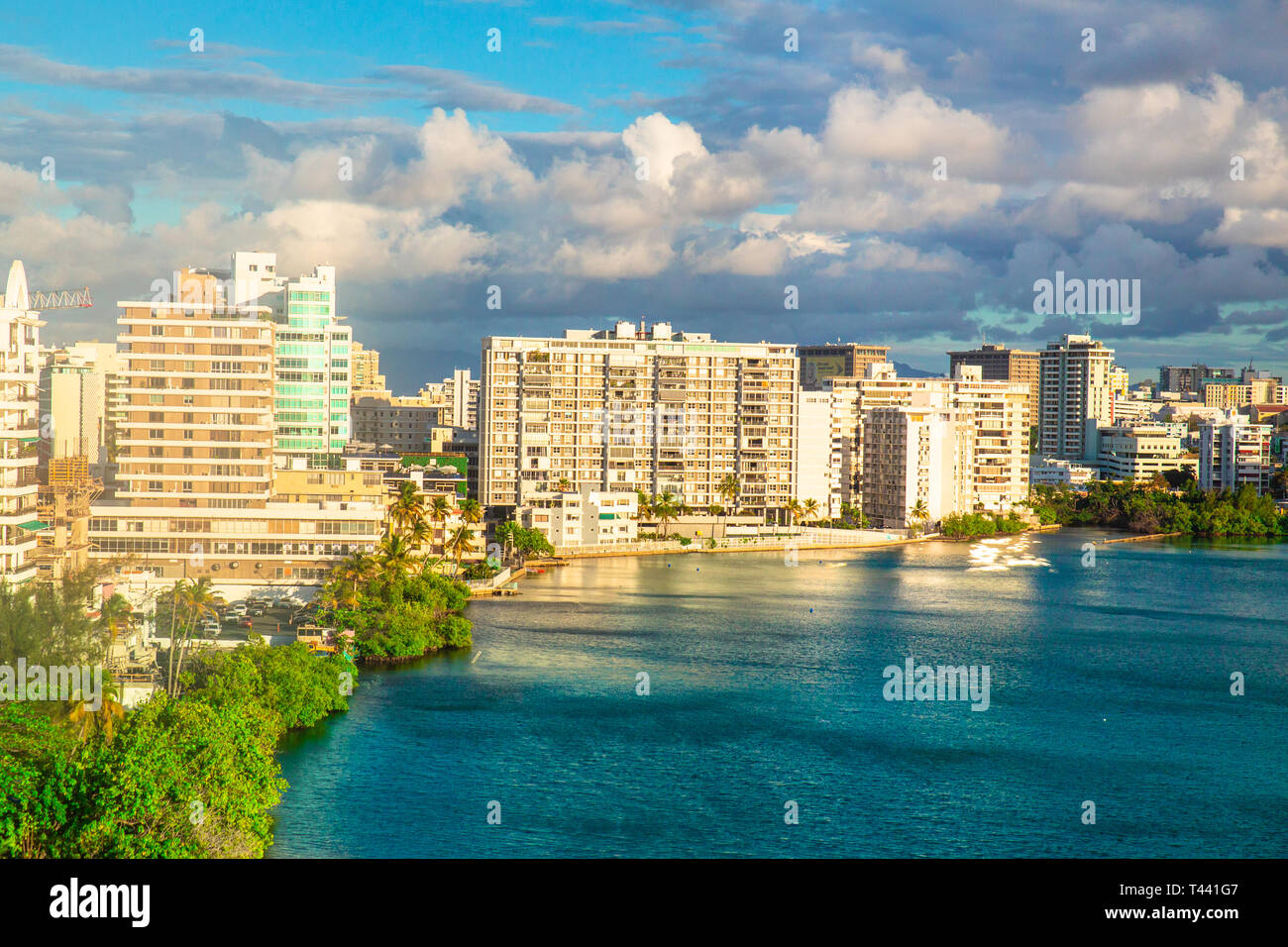 View of Condado area of San Juan Puerto Rico with bay and buildings on a day with clouds and sun Stock Photo