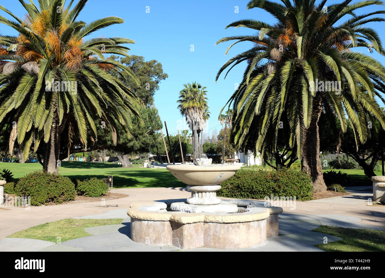 SANTA BARBARA, CALIFORNIA - APRIL 11, 2019: Chase Palm Park fountain and palm trees. A public park along the waterfront with play areas, pond, picnic  Stock Photo