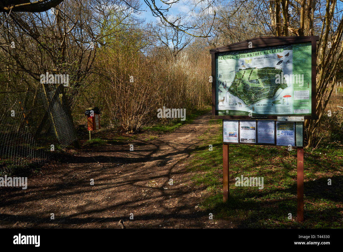 Map and sign along the woodland path in the spring sunshine, Selsdon