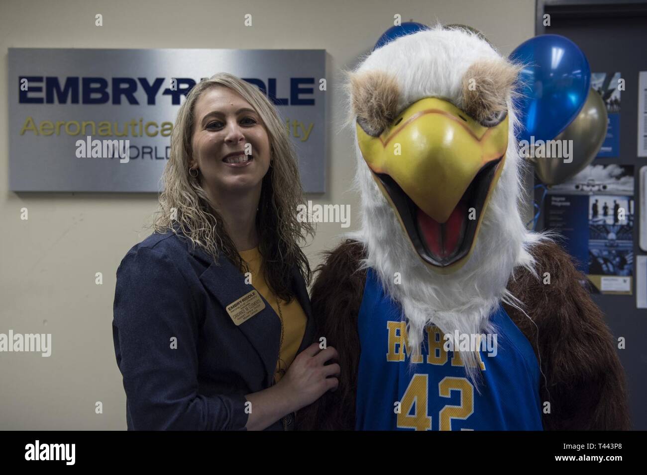 Candance Clements, left, the Misawa Embry-Riddle Aeronautical University assistant campus director, pauses for a photo during the ERAU grand re-opening with the school’s mascot, right, at Misawa Air Base, Japan, March 13, 2019. The institution offers nine-week courses focusing on aeronautics, aviation maintenance, aviation business administration, aviation security, unmanned systems applications and human factors. Stock Photo