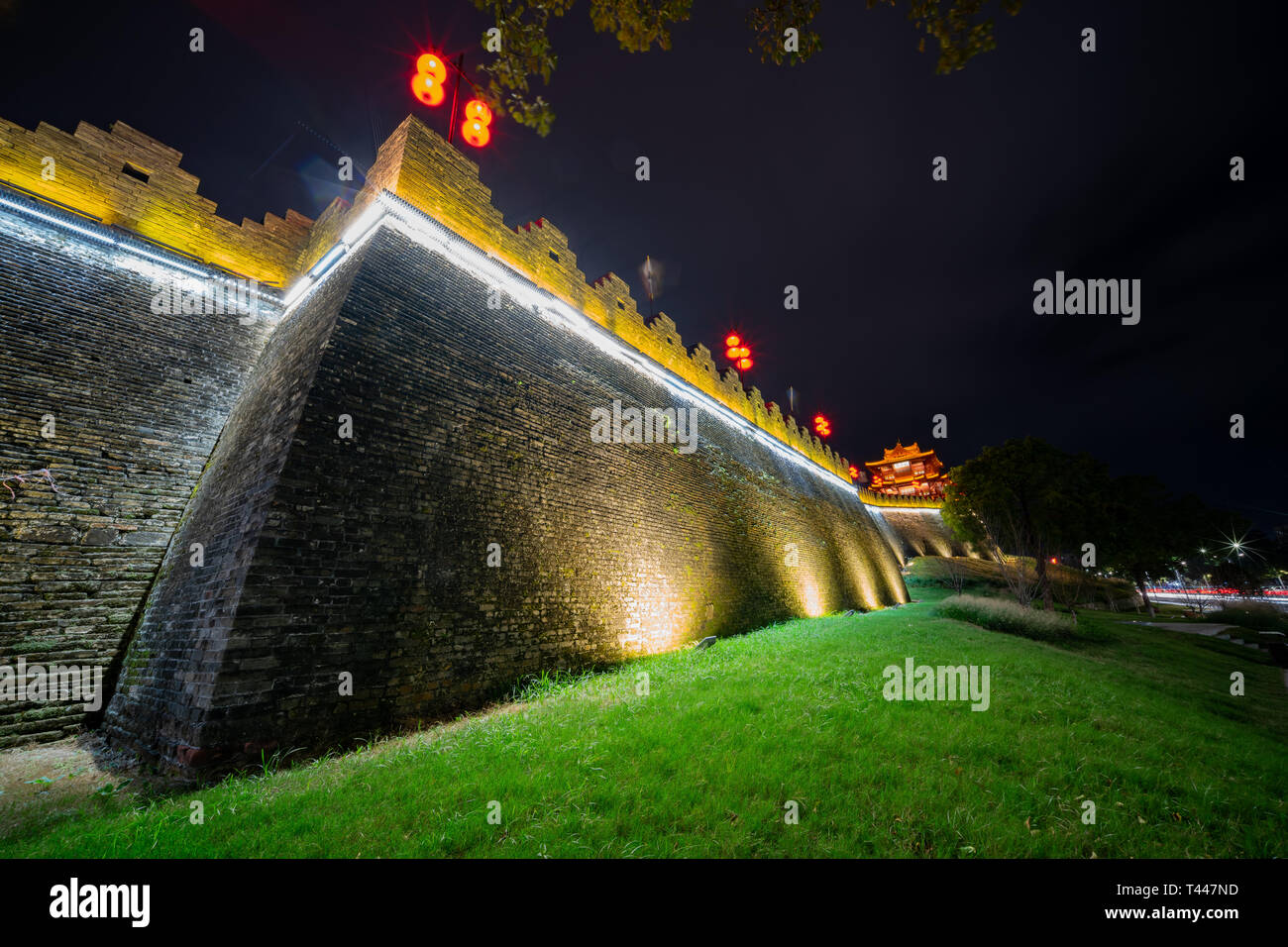 Night view of the Zhaoqing Ancient City Wall with Pi Yun Lou building ...