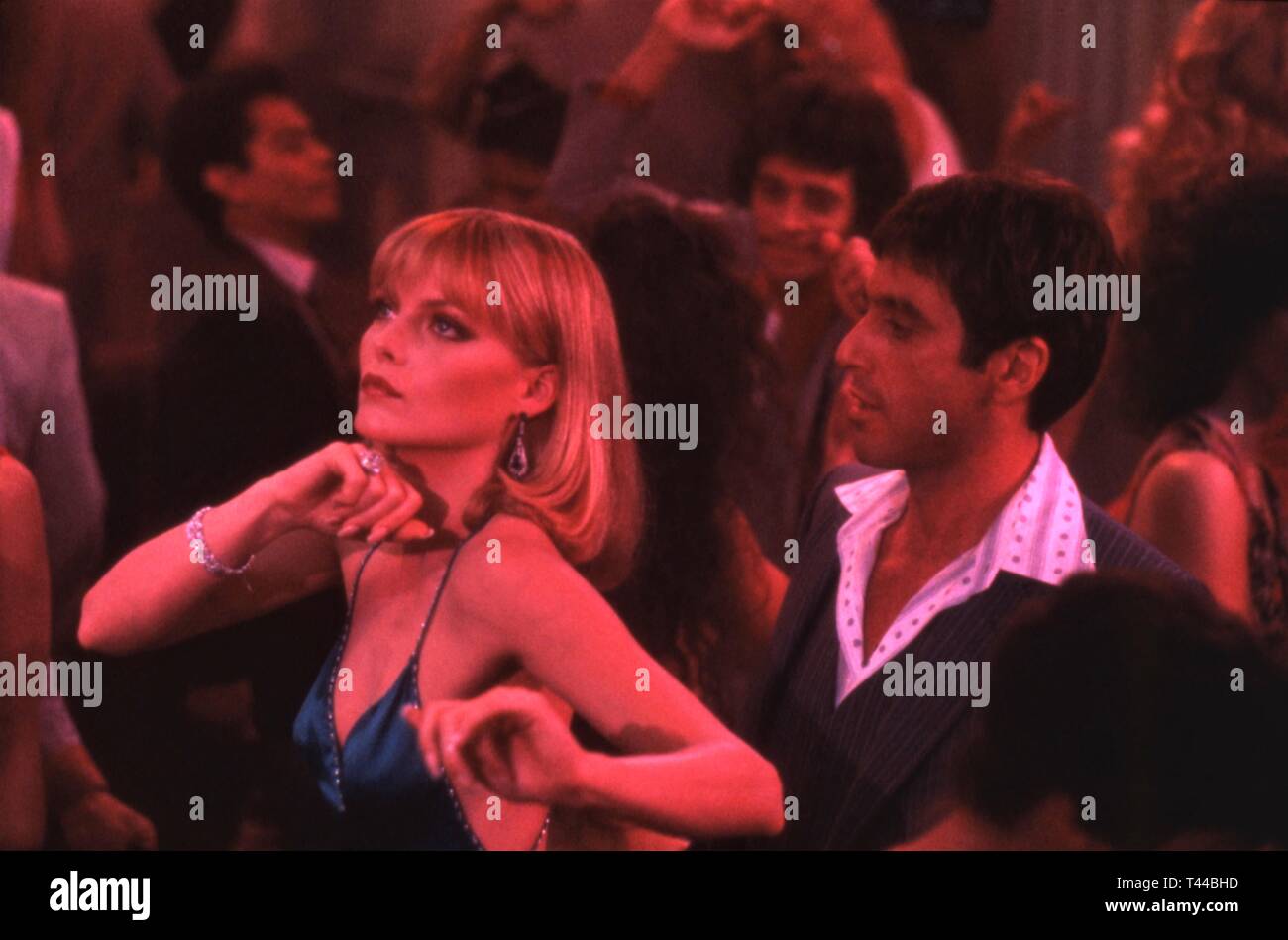 Al Pacino as Tony Montana Michelle Pfeifer as Elvira SCARFACE 1983 director Brian De Palma screenplay Oliver Stone Universal Pictures Stock Photo