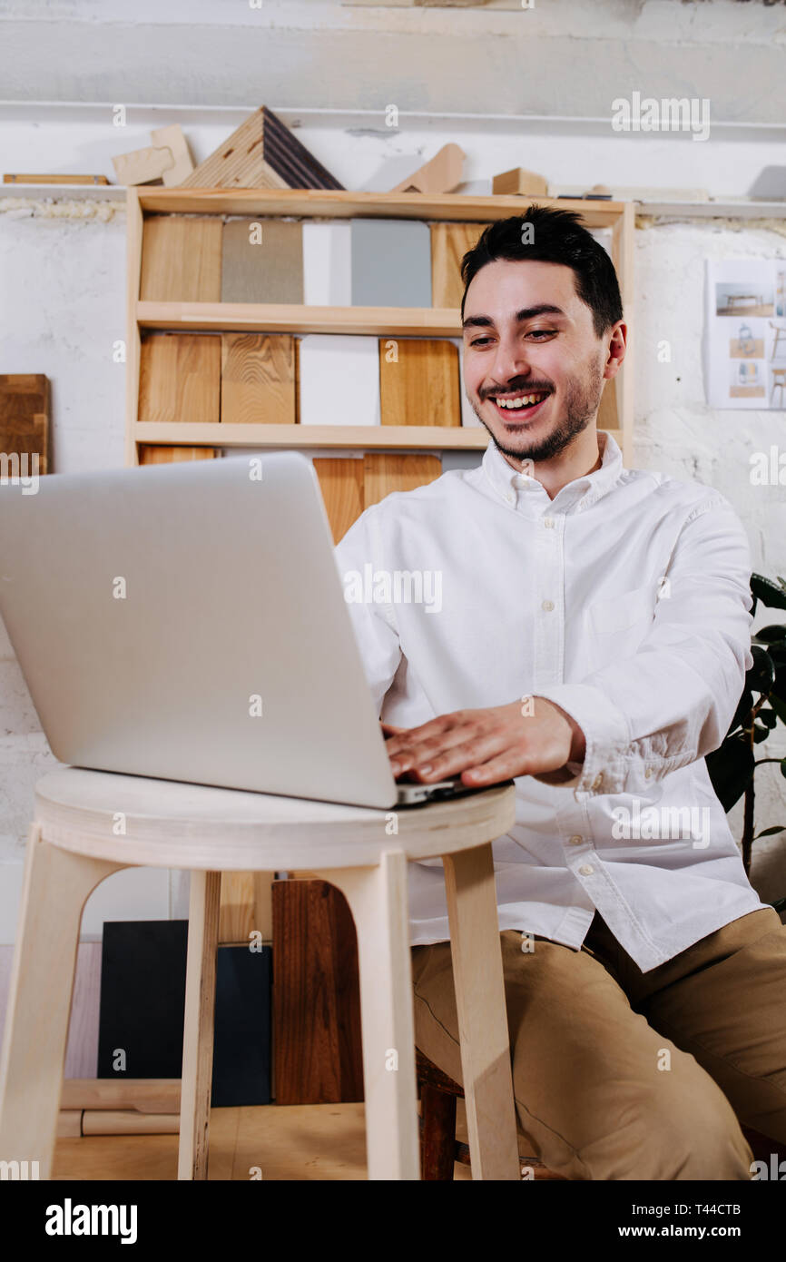 Environmental portrait of a furniture designer maker in his