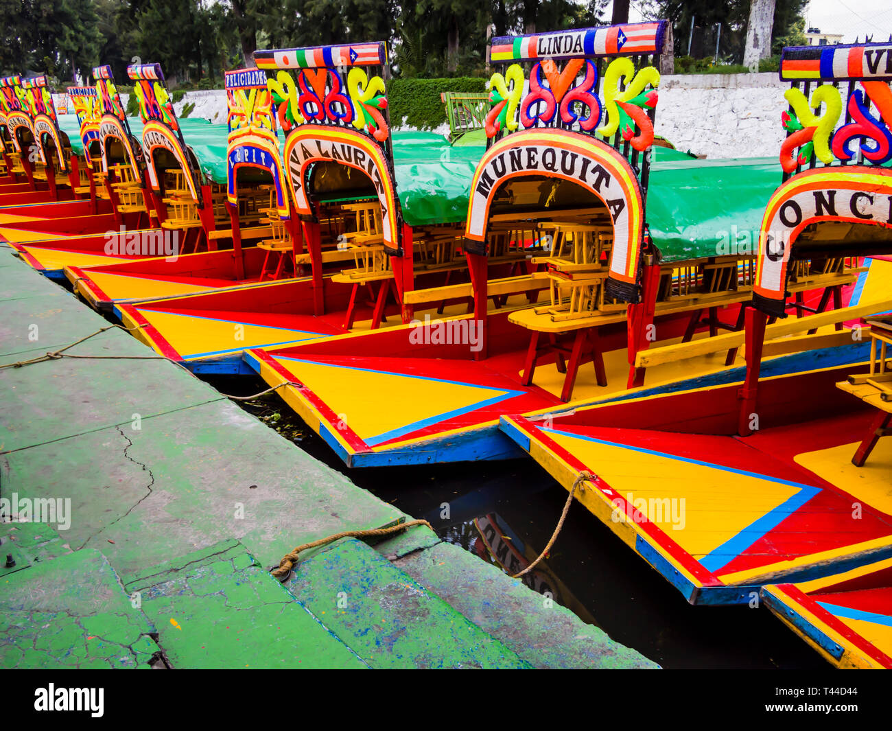 Row of traditional, colorful boats in Xochimilco, Mexico City Stock Photo