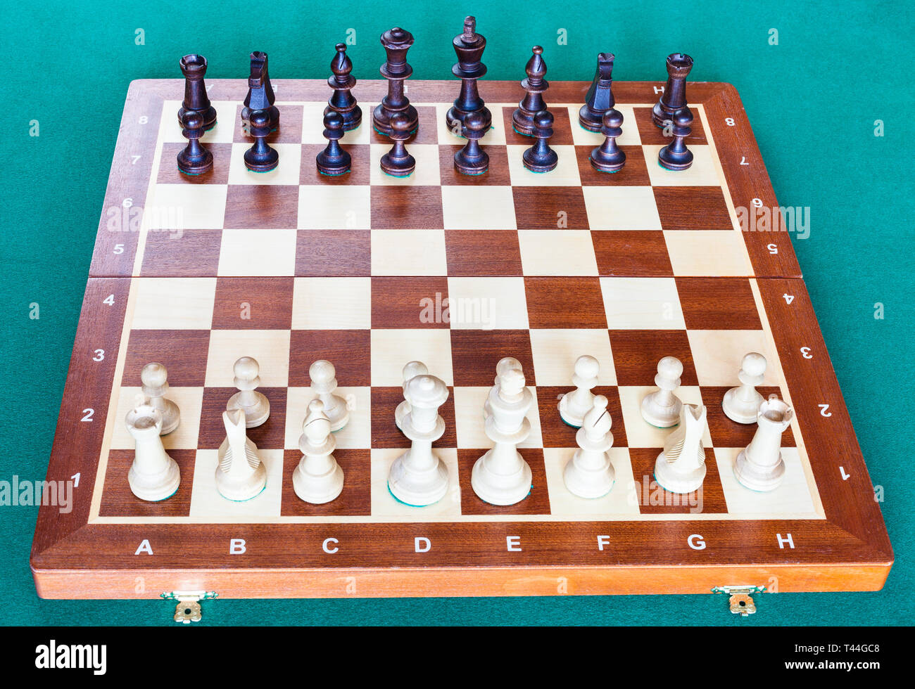 Chess Pieces In Starting Position On A Wooden Board Stock Photo - Download  Image Now - iStock