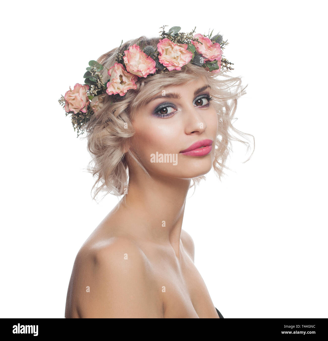 Beautiful Blonde Woman With Short Curly Hair Makeup And Flowers