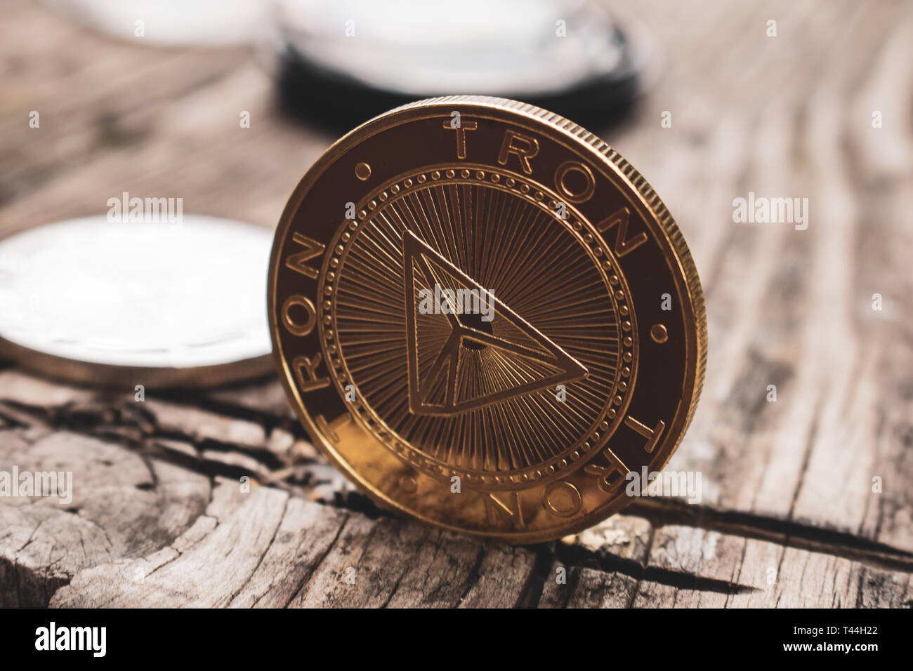 Golden coin Tron TRX, digital money, new cryptocurrency. Tron is a promising cryptocurrency. Stock Photo