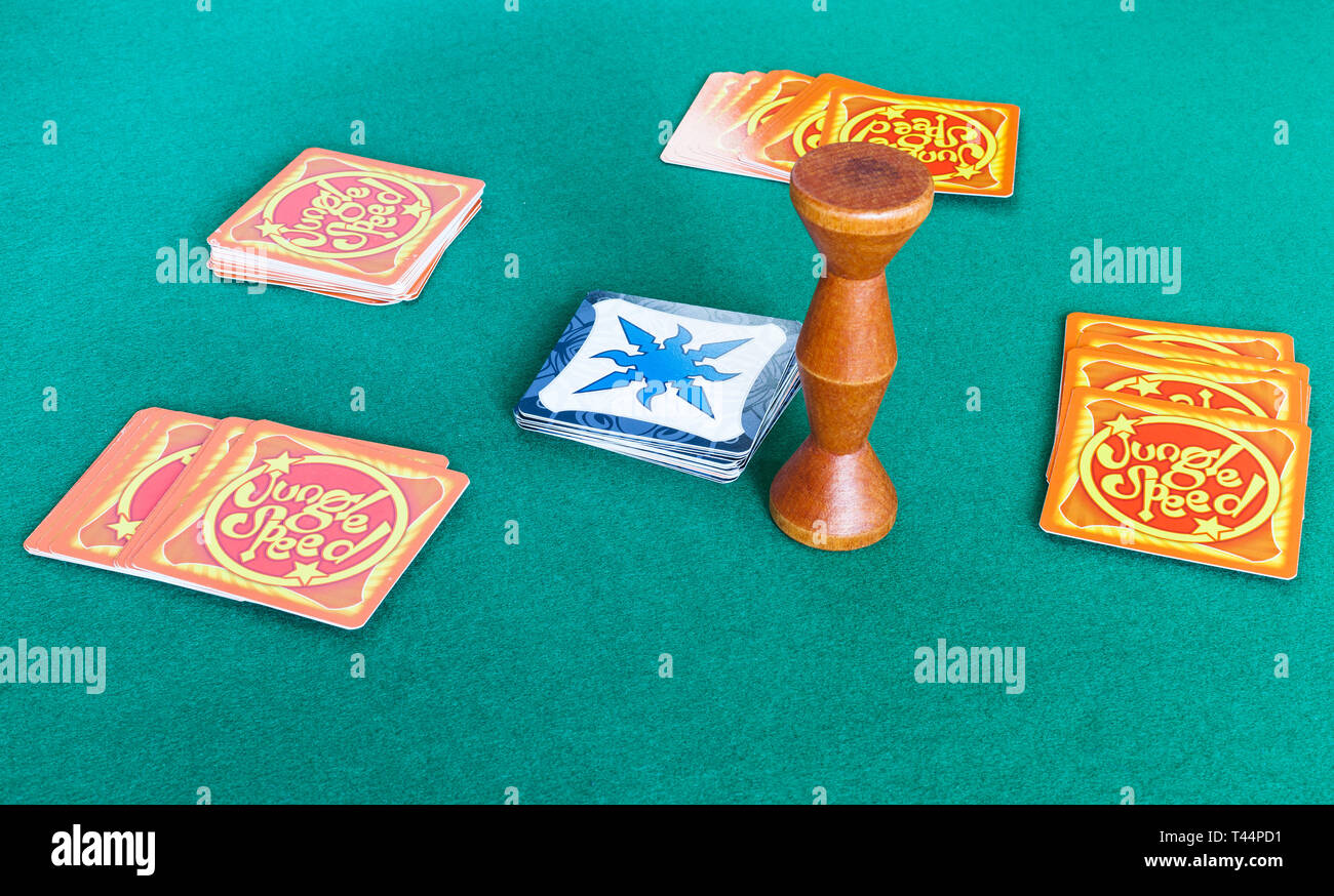 MOSCOW, RUSSIA - APRIL 2, 2019: items of Jungle Speed board game on green baize table. Jungle Speed is a card game created by Thomas Vuarchex and Pier Stock Photo