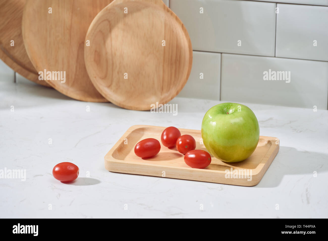 Kitchen utensils with fresh vegetable and fruit on the table. Kitchen still life. Stock Photo