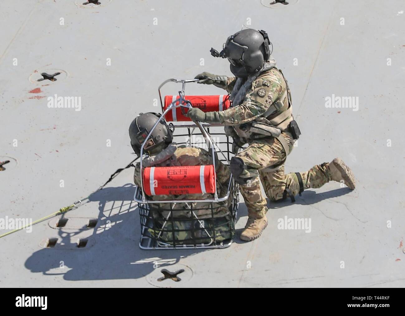 Flight medics of a UH-60 Black Hawk helicopter assigned to Company C ...