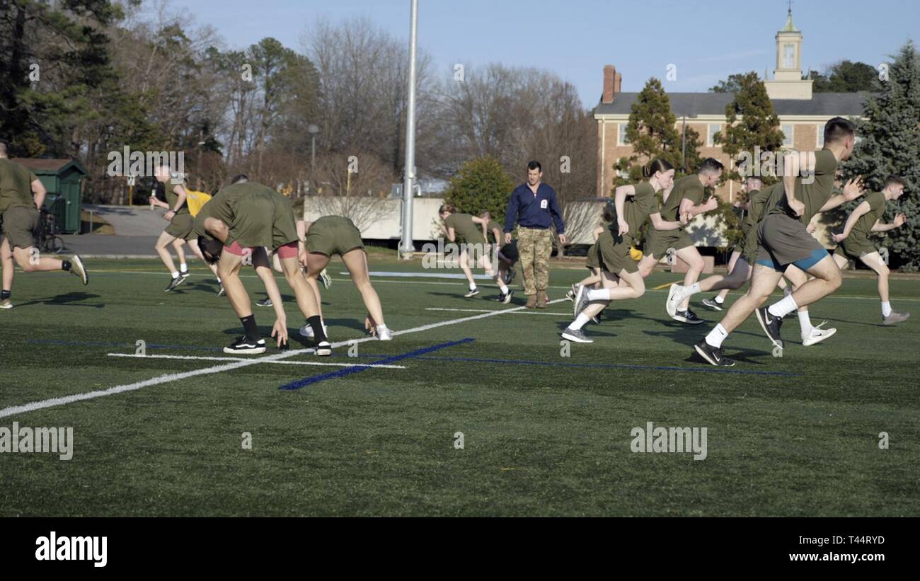 CHAPEL HILL, N.C. (Feb. 21, 2018) – Students belonging to the North Carolina Piedmont Region Consortium NROTC Unit participate in an instructor-lead workout session made to approximate the day-to-day PT routine at the Marine Corps Officer Candidate School which all Marine Corps Option Midshipmen must complete prior to commissioning, during a physical training and injury prevention medical lab held at the University of North Carolina. This training highlighted a growing focus on not only preparing candidates for the physical requirements of their job, but preparing them to maintain physical hea Stock Photo