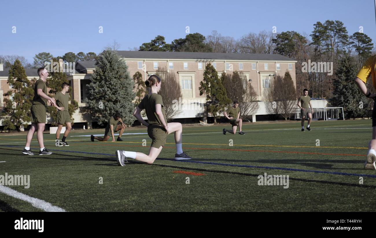 CHAPEL HILL, N.C. (Feb. 21, 2018) – Students belonging to the North Carolina Piedmont Region Consortium NROTC Unit participate in an instructor-lead workout session made to approximate the day-to-day PT routine at the Marine Corps Officer Candidate School which all Marine Corps Option Midshipmen must complete prior to commissioning, during a physical training and injury prevention medical lab held at the University of North Carolina. This training highlighted a growing focus on not only preparing candidates for the physical requirements of their job, but preparing them to maintain physical hea Stock Photo