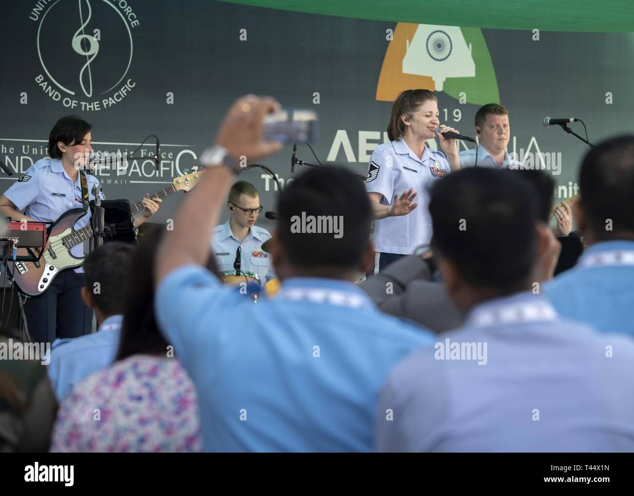 U.S. Air Force Band of the Pacific members perform for a crowd during Aero India 2019, Feb. 23, at Air Force Station Yelahanka, Bengaluru, India. The airshow is an opportunity to strengthen bonds between the U.S. and international partners. Stock Photo