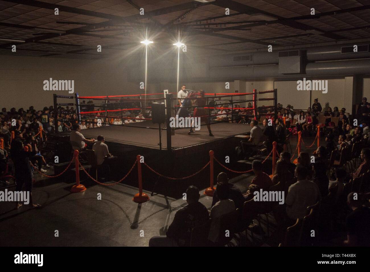 Spectators watch a boxing match during the Pearlside Boxing Club event, Marine Corps Base Hawaii, Feb