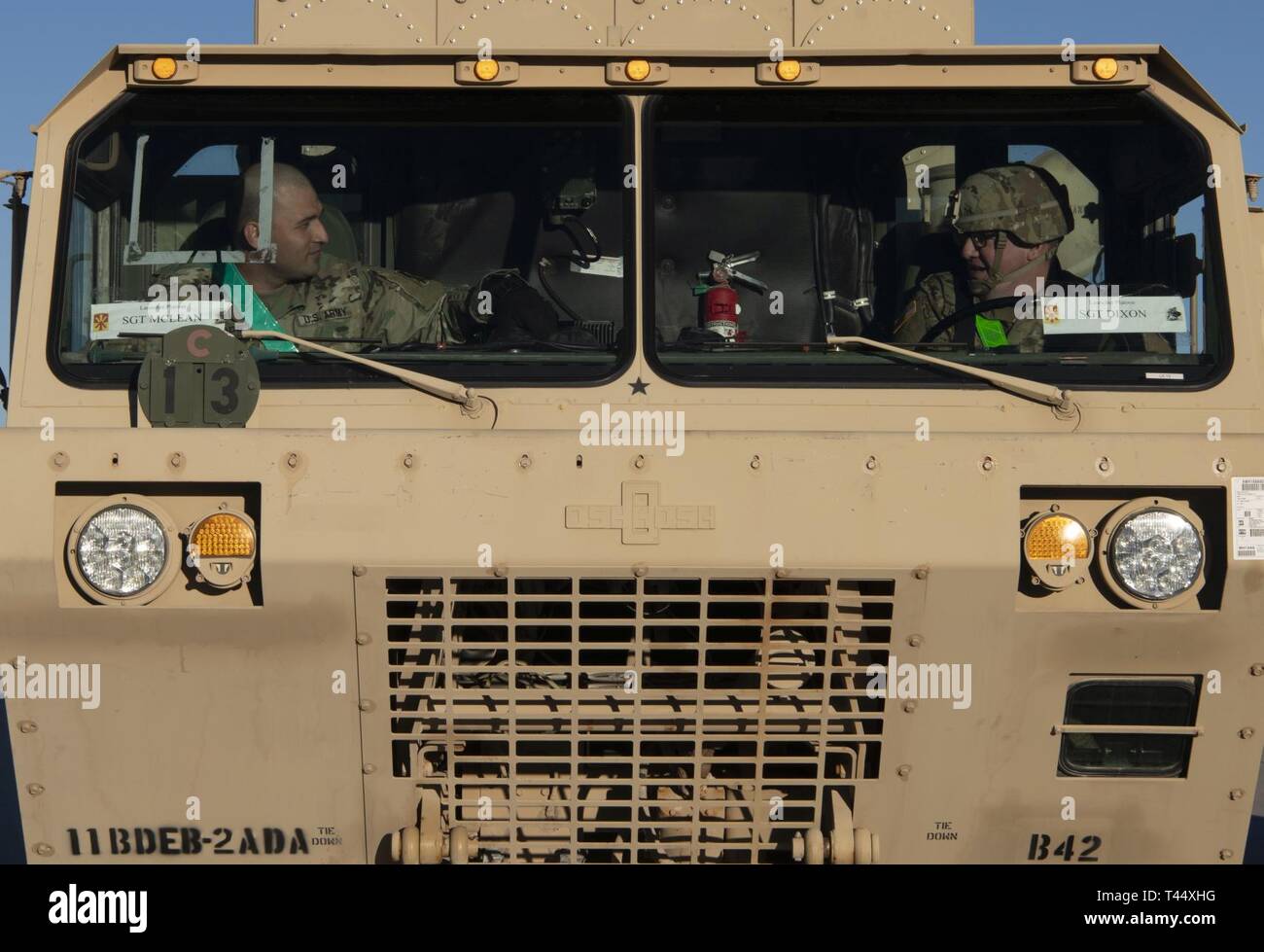 U.S. Army Sgt. Michael Moriarty,  Bravo 2 Terminal High Altitude Area Defense Battery, 2nd Battalion, patriot fire control operator, prepares to load onto a 4th Airlift Squadron C-17 Globemaster III at Fort Bliss, Texas, Feb. 23, 2019. The THAAD missile system is a land-based platform capable of intercepting ballistic missiles both inside and just outside the atmosphere. Stock Photo