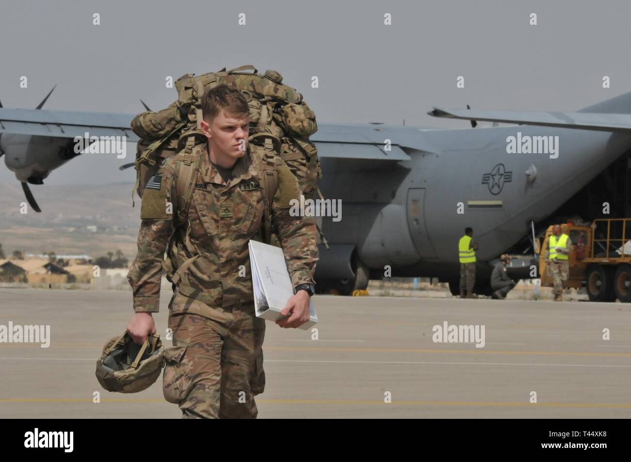 A U.S. Army Soldier with the 173rd Airborne Brigade disembarks a C-130 Hercules at Nevatim Air Base, Israel, Feb 23, 2019 . The deployment of a Terminal Altitude Area Defense System to Israel is an exercise involving U.S. Army, U.S. Air Force and Israeli forces, under the Dynamic Force Employment concept. The exercise builds readiness and interoperability in the region, demonstrates the U.S. capability to rapidly deploy air defense assets globally, and demonstrates U.S. Army Europe's mission to deter potential adversaries and support allies. Stock Photo