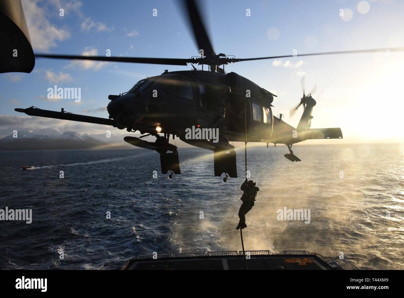 A member of Coast Guard Maritime Security Response Team West fastropes