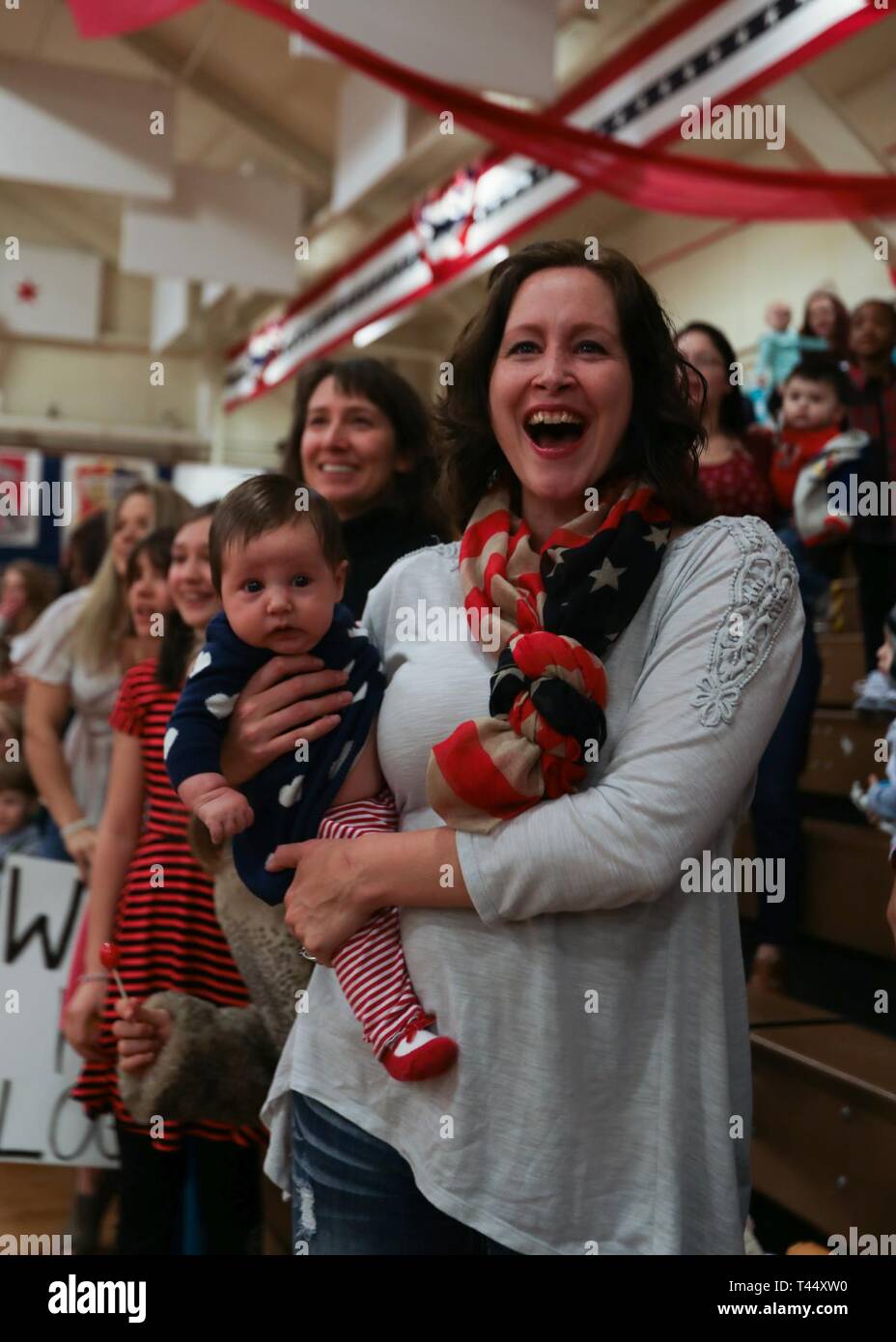 Family members cheer at the first glimpse of Soldiers from the 4th
