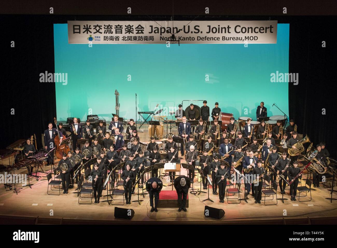 The conductors take a bow at the conclusion of the Japan-U.S. Joint Concert Feb. 24, 2019, at the Hamura Learning Center in Hamura, Tokyo, Japan. Members of the USAF Band of the Pacific and the Hamura Daiichi Jr. High School Band mixed and played as one for the event. Stock Photo