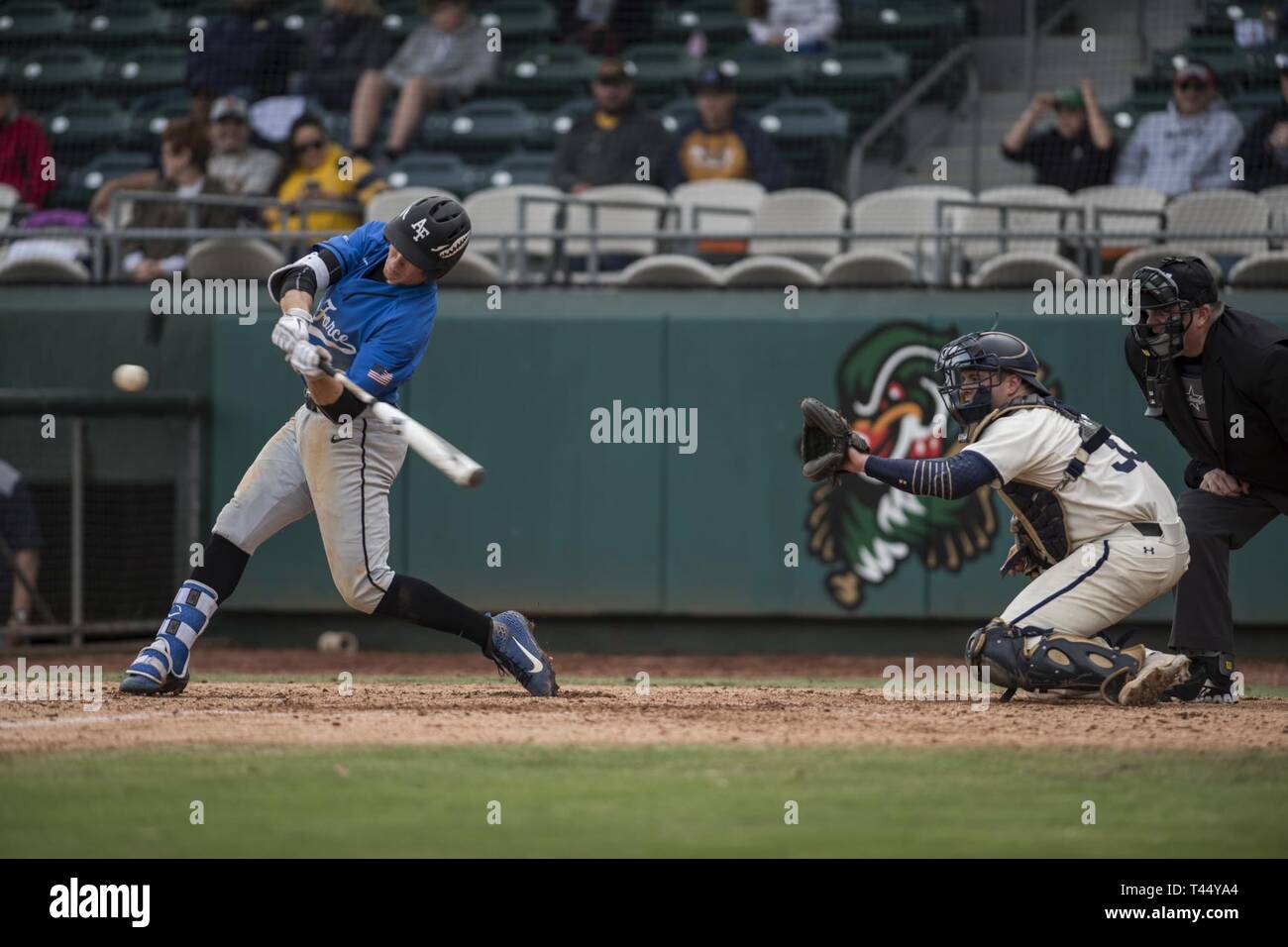 Air Force Academy cadet Drew Wiss hits a baseball during the second