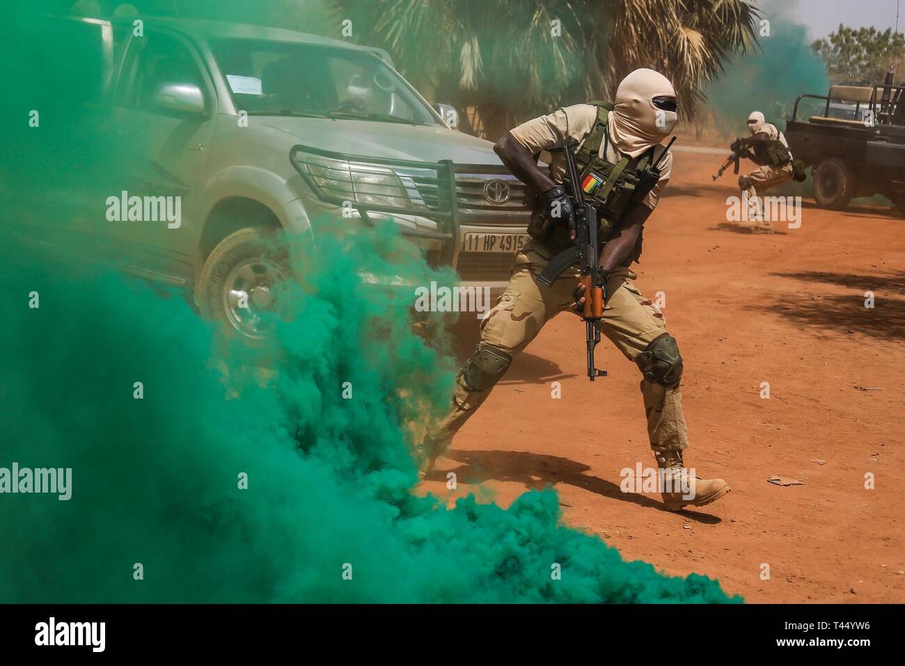 Malian special forces soldiers conduct close quarters battle maneuver training near base camp Loumbila, Burkina Faso, Feb. 25, 2019. The exercise enables Malian soldiers to become proficient with battle movements and communication. Stock Photo