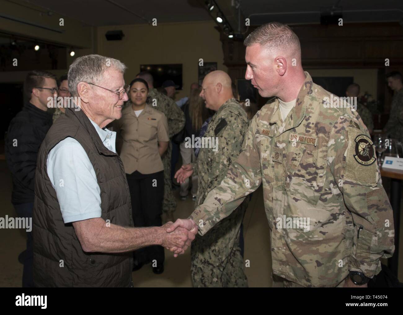 NAVAL STATION ROTA, Spain (February 25, 2019) U.S. Senator (R-OK) James  Inhofe, left, talks with Air Force Master Sgt. Tyler Kost, assigned to  725th Air Mobility Squadron, during a meet and greet