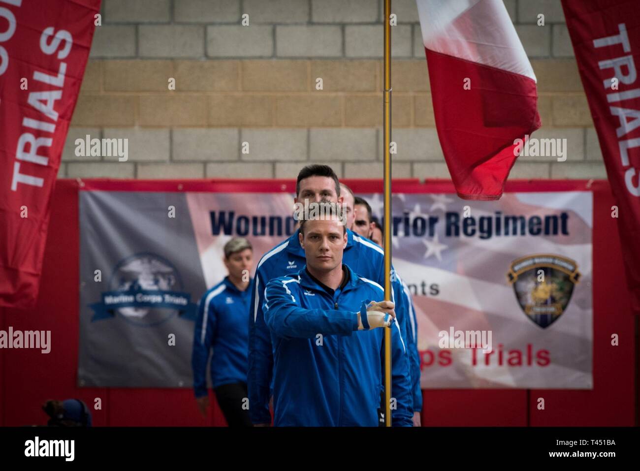 MARINE CORPS BASE CAMP PENDLETON, CALIFORNIA – Athletes from Team France march with their nation’s colors during the 2019 Marine Corps Trials opening ceremony at Marine Corps Base Camp Pendleton, California, Feb. 26, 2019. The Marine Corps Trials promotes recovery and rehabilitation for nearly 200 recovering service members and veterans through adaptive sport participation and serves as the primary venue to select Marine Corps participants for the DoD Warrior Games. (Official U.S. Marine Corps Stock Photo