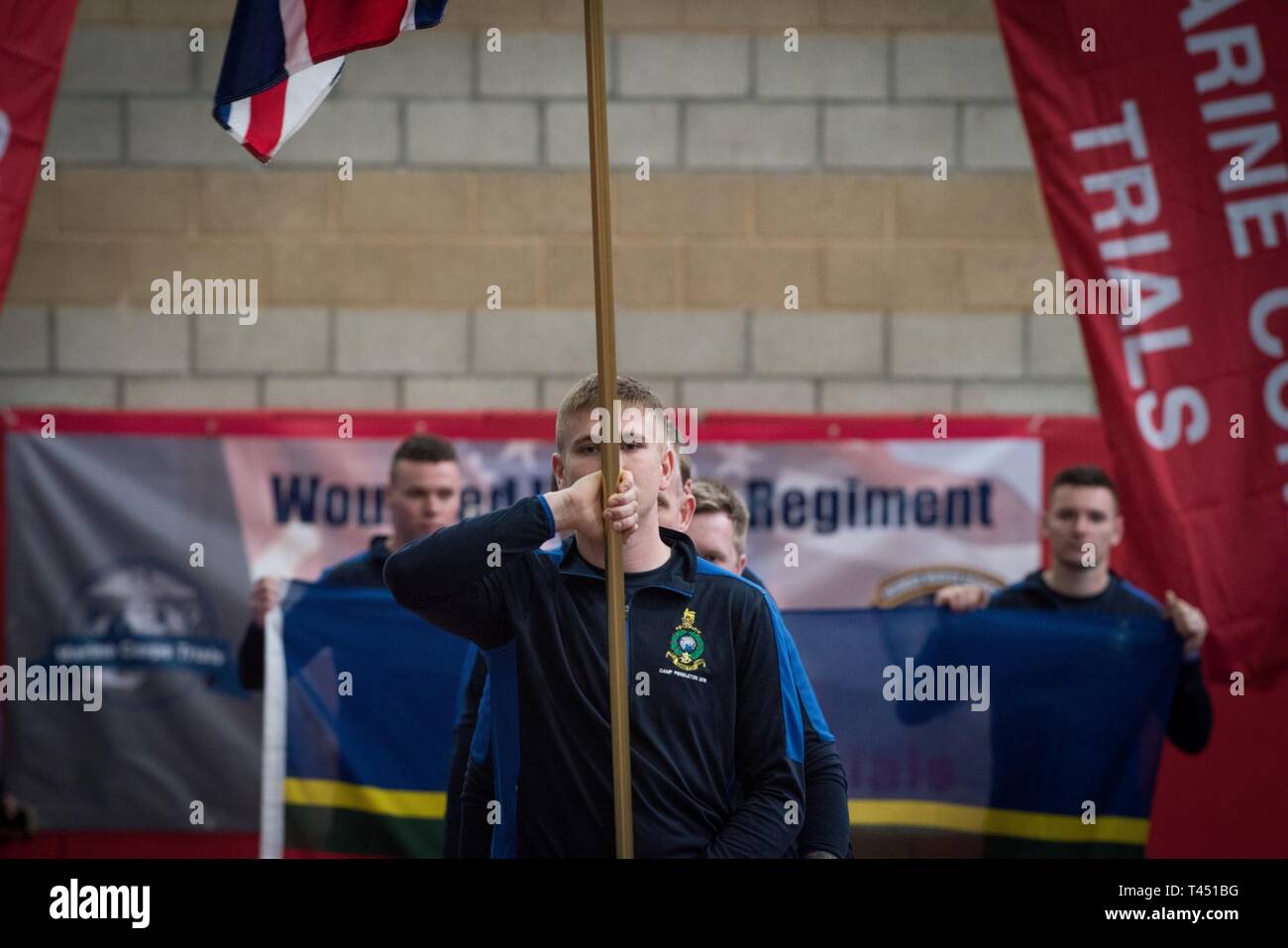 MARINE CORPS BASE CAMP PENDLETON, CALIFORNIA – Members of the United Kingdom march in during the 9th annual Marine Corps Trials opening ceremony at Marine Corps Base Camp Pendleton, California, Feb. 26, 2019. The Marine Corps Trials promotes recovery and rehabilitation through adaptive sport participation and develops camaraderie among recovering service members (RSMs) and veterans. Additionally, the Trials serve as an opportunity for RSMs to demonstrate physical and mental achievements and as the primary venue to select Marine Corps participants for the DoD Warrior Games. (Official U.S. Marin Stock Photo