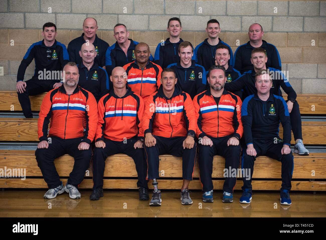 MARINE CORPS BASE CAMP PENDLETON, CALIFORNIA –Teams United Kingdom, Netherlands and France pose for a photo after the 2019 Marine Corps Trials opening ceremony at Marine Corps Base Camp Pendleton, California, Feb. 26, 2019. The Marine Corps Trials promotes recovery and rehabilitation through adaptive sport participation and develops camaraderie among recovering service members (RSMs) and veterans. It is an opportunity for RSMs to demonstrate their achievements and serves as the primary venue to select Marine Corps participants for the DoD Warrior Games. Stock Photo