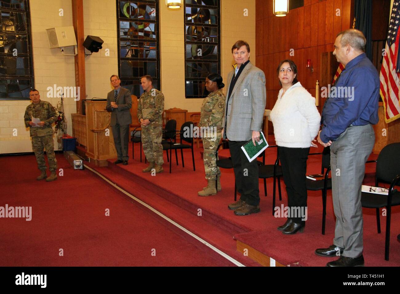 Fort Hamilton Garrison Commander Col. Andrew S. Zieseniss (far left) and the senior U.S. Army officer responsible for Fort Hamilton Maj. Gen. Jeffrey Milhorn (3rd from left) held a town hall meeting with base housing residents Wednesday, Feb. 26 at the Post Chapel to hear their issues and concerns.    Vincent Grewatz (2nd from left), the U.S. Army Installation Management Command senior executive who manages garrison support to Training and Doctrine Command bases like Fort Hamilton, traveled from his headquarters at Fort Eustis, Virginia to participate in the town hall. Grewatz made opening and Stock Photo