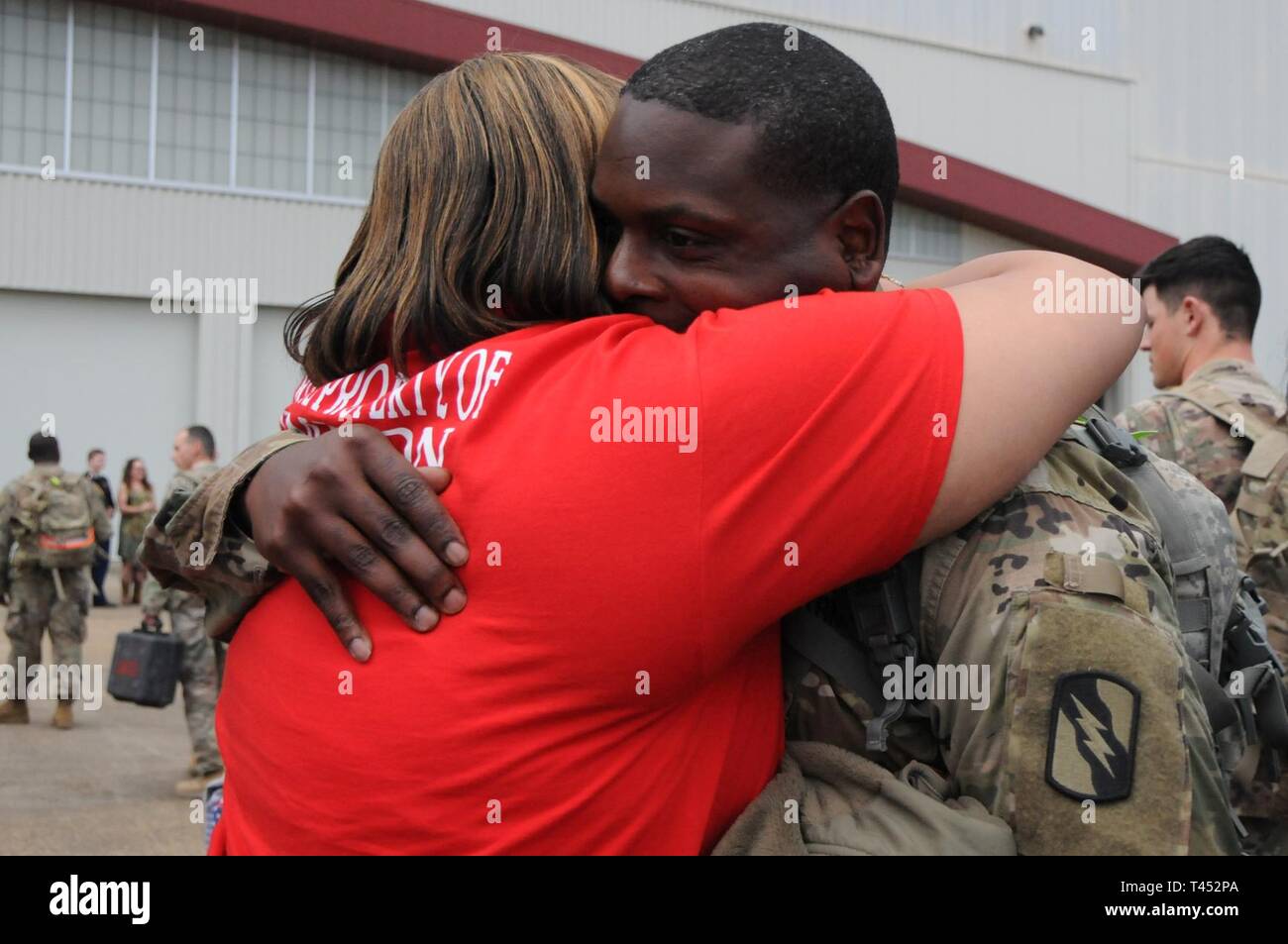 Spc. Earnest Jimison, of DeKalb, greets a loved one at Thompson Field in Flowood, Miss., Feb. 27, 2019. Jimison, was part of a contingent of the Mississippi Army National Guard’s 155th Armored Brigade Combat Team returning home after serving in Kuwait in support of Operation Spartan Shield for approximately one year. The arrivals, with Soldiers from various brigade subordinate units, are part of a series of flights that will return brigade Soldiers home through the end of March. Stock Photo