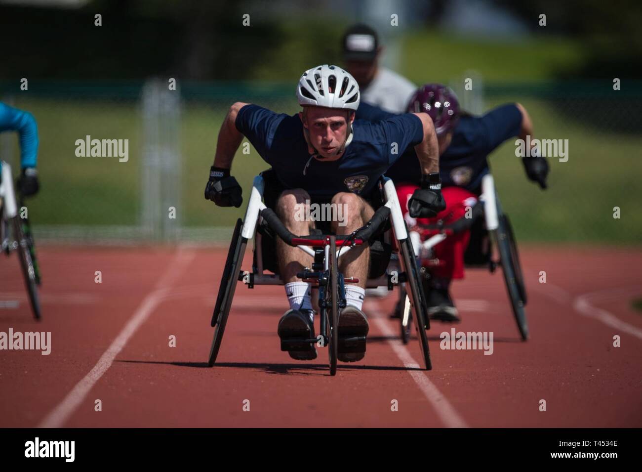MARINE CORPS BASE CAMP PENDLETON, CALIFORNIA – A U.S. Marine Corps athlete races to the finish during the 2019 Marine Corps Trials at Marine Corps Base Camp Pendleton, California, Feb. 27. The Marine Corps Trials promotes recovery and rehabilitation through adaptive sports participation and develops camaraderie among recovering service members and veterans. Additionally, the competition is an opportunity for participants to demonstrate physical and mental achievements and serves as the primary venue to select Marine Corps participants for the DoD Warrior Games. (Official U.S. Marine Corps Stock Photo