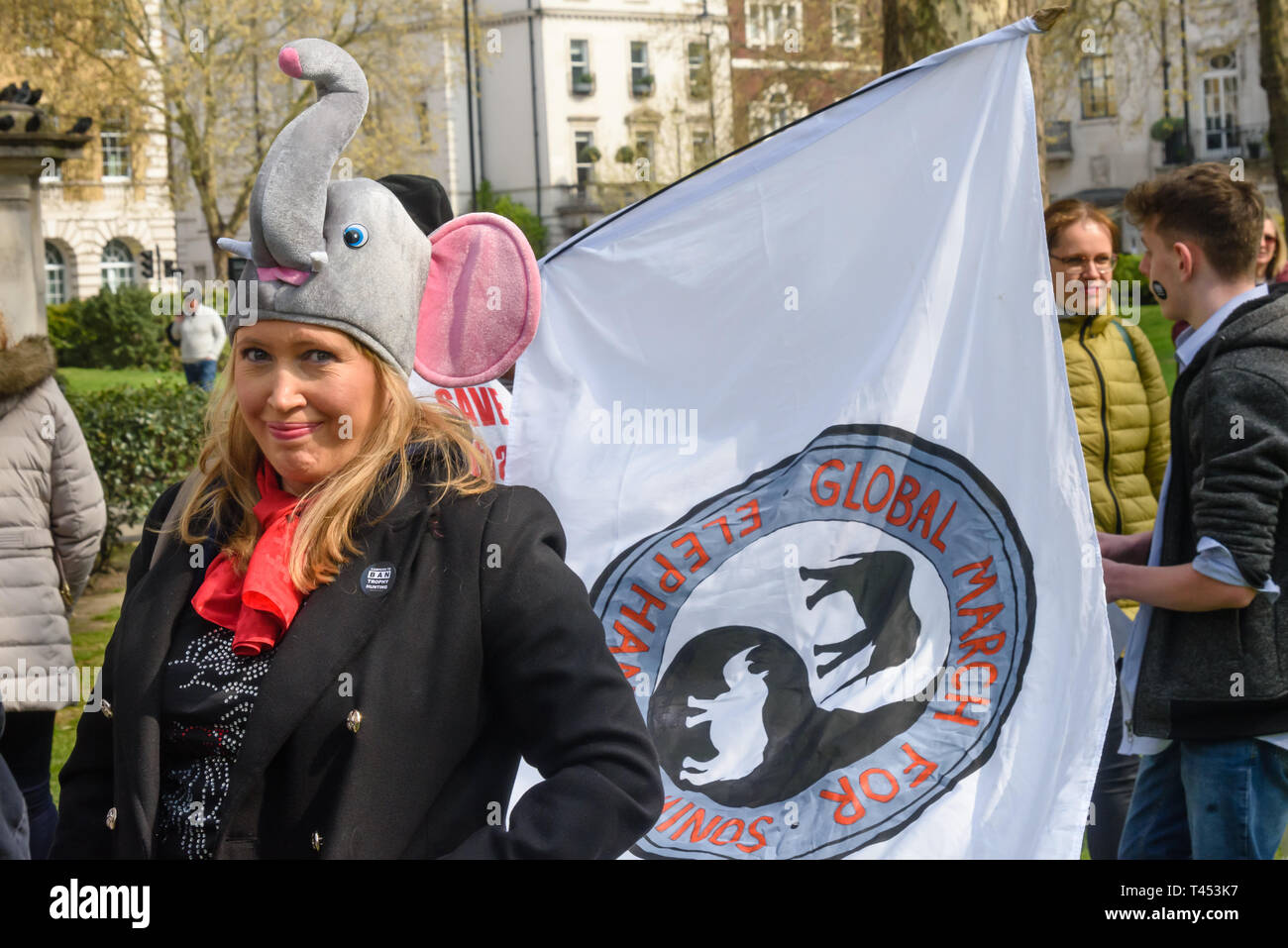 London, UK. 13th April 2014. People meet in Cavendish Square to march through London  to a rally opposite Downing St as a part of the 2019 Global March for Elephants and Rhinos. They called on the UK government to impose a ban on the import of hunting trophies of endangered species to the UK, and supported an increase in the protection under CITES for elephants and opposed attempts to downgrade protection of endangered species or reopen trade in ivory and other body parts. Peter Marshall/Alamy Live News Stock Photo