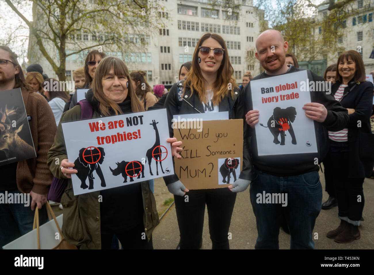London, UK. 13th April 2014. People meet in Cavendish Square to march through London to a rally opposite Downing St as a part of the 2019 Global March for Elephants and Rhinos. They called on the UK government to impose a ban on the import of hunting trophies of endangered species to the UK, and supported an increase in the protection under CITES for elephants and opposed attempts to downgrade protection of endangered species or reopen trade in ivory and other body parts. Peter Marshall/Alamy Live News Stock Photo