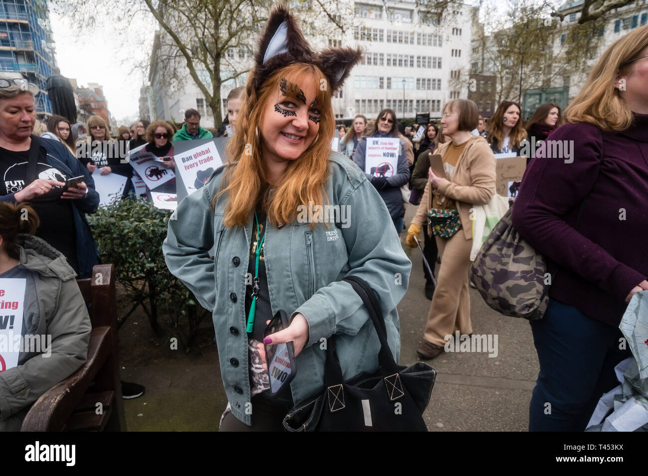 London, UK. 13th April 2014. A 'Foxy Lady' poses for a photograph in Cavendish Square before the march through London  to a rally opposite Downing St as a part of the 2019 Global March for Elephants and Rhinos. They called on the UK government to impose a ban on the import of hunting trophies of endangered species to the UK, and supported an increase in the protection under CITES for elephants and opposed attempts to downgrade protection of endangered species or reopen trade in ivory and other body parts. Peter Marshall/Alamy Live News Stock Photo