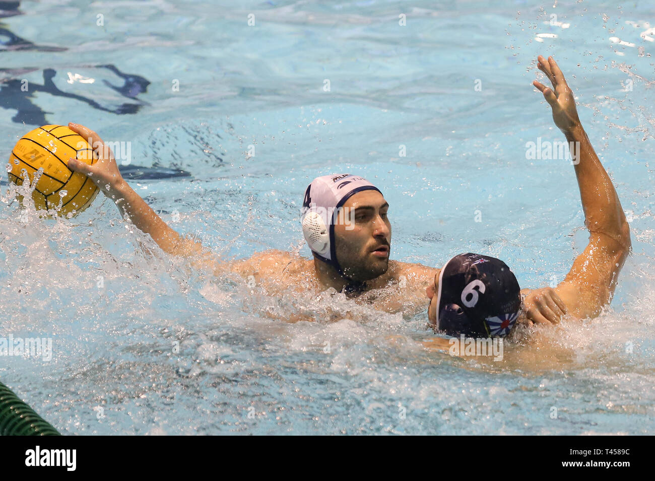 Zagreb, Croatia. 13th Apr, 2019. Marino Cagalj (L) of HAVK Mladost competes  with Marin Delic of Jadran Split during LEN Champions League, group B match  between HAVK Mladost and Jadran Split in