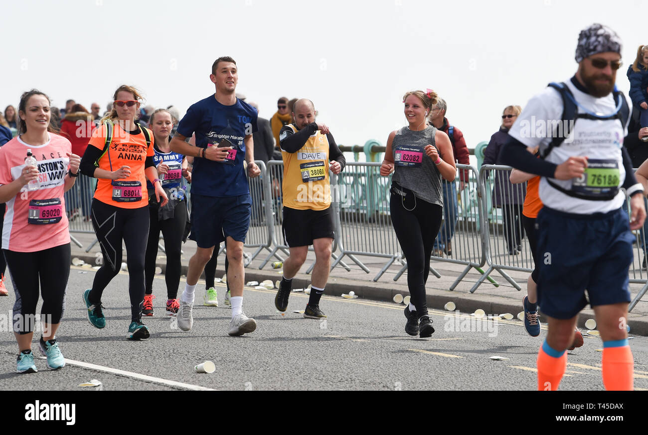 Brighton UK 14th April 2019 -   Thousands of runners some in fancy dress take part in this years Brighton Marathon which is celebrating its 10th anniversary Credit: Simon Dack/Alamy Live News Stock Photo