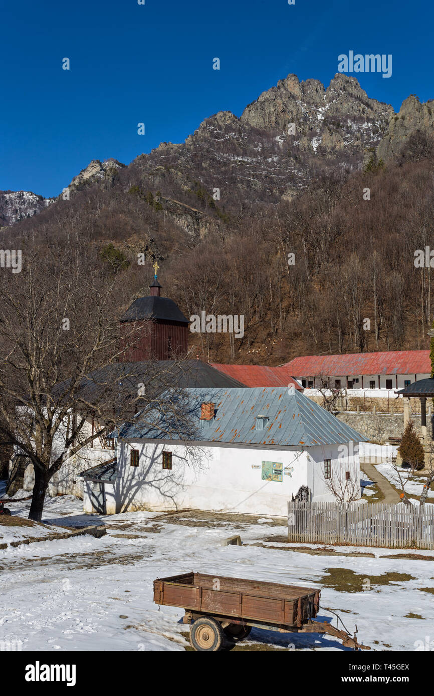 Orthodox monastery Stanisoara in Cozia mountain during sunny winter day Stock Photo