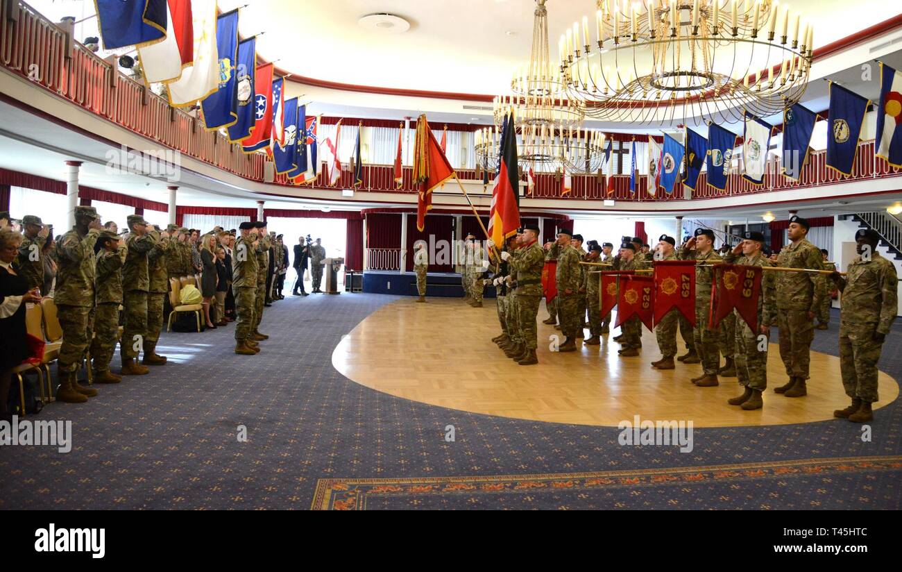 The command and color guard presenting honors during the playing of