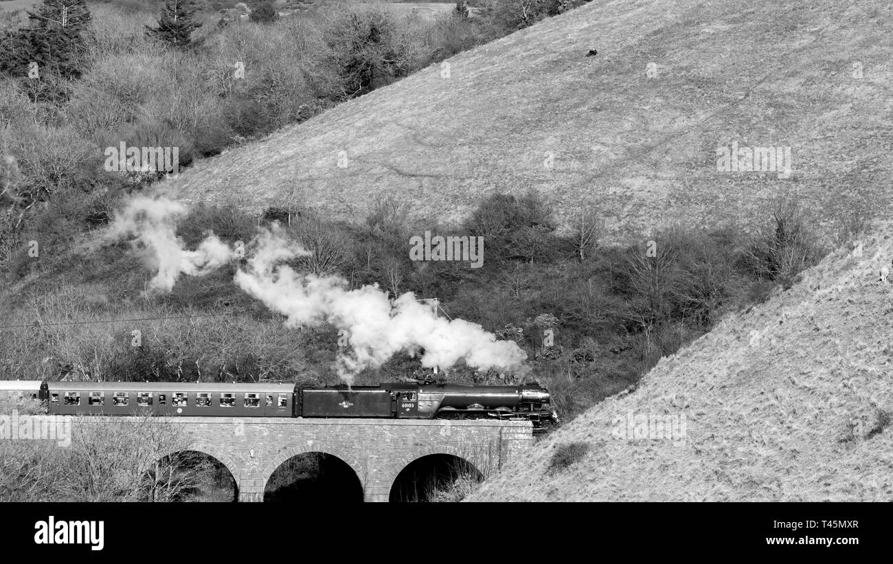 Flying Scotsman pass the bridge at Corfe Castle hill, Dorset, UK Stock Photo