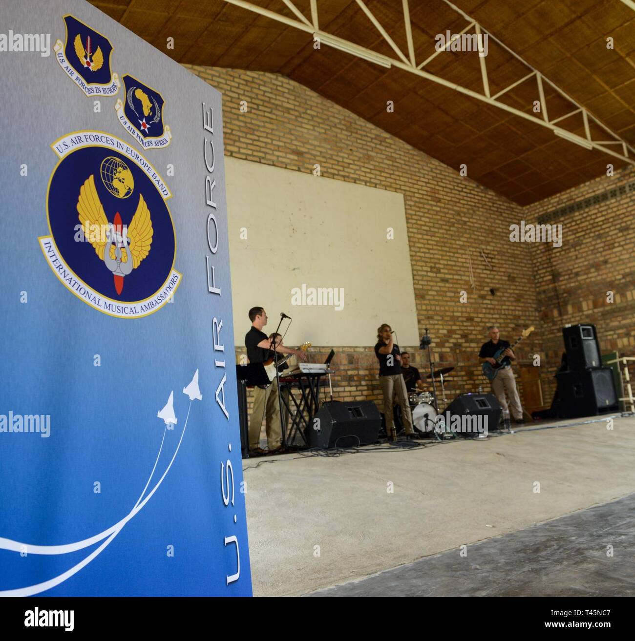 U.S. Airmen assigned to the U.S. Air Forces in Europe Band Touch N' Go perform sound checks at the Home de la vierge des Pauvres Gatagara/Nyanza in the Nyanza District, Rwanda, March 5, 2019. The USAFE Band played for HVP Nyanza as part of an outreach event. The band uses these events to further increase cultural ties and enhance the people-to-people relationship between the United States and its partners such as Rwanda. Stock Photo