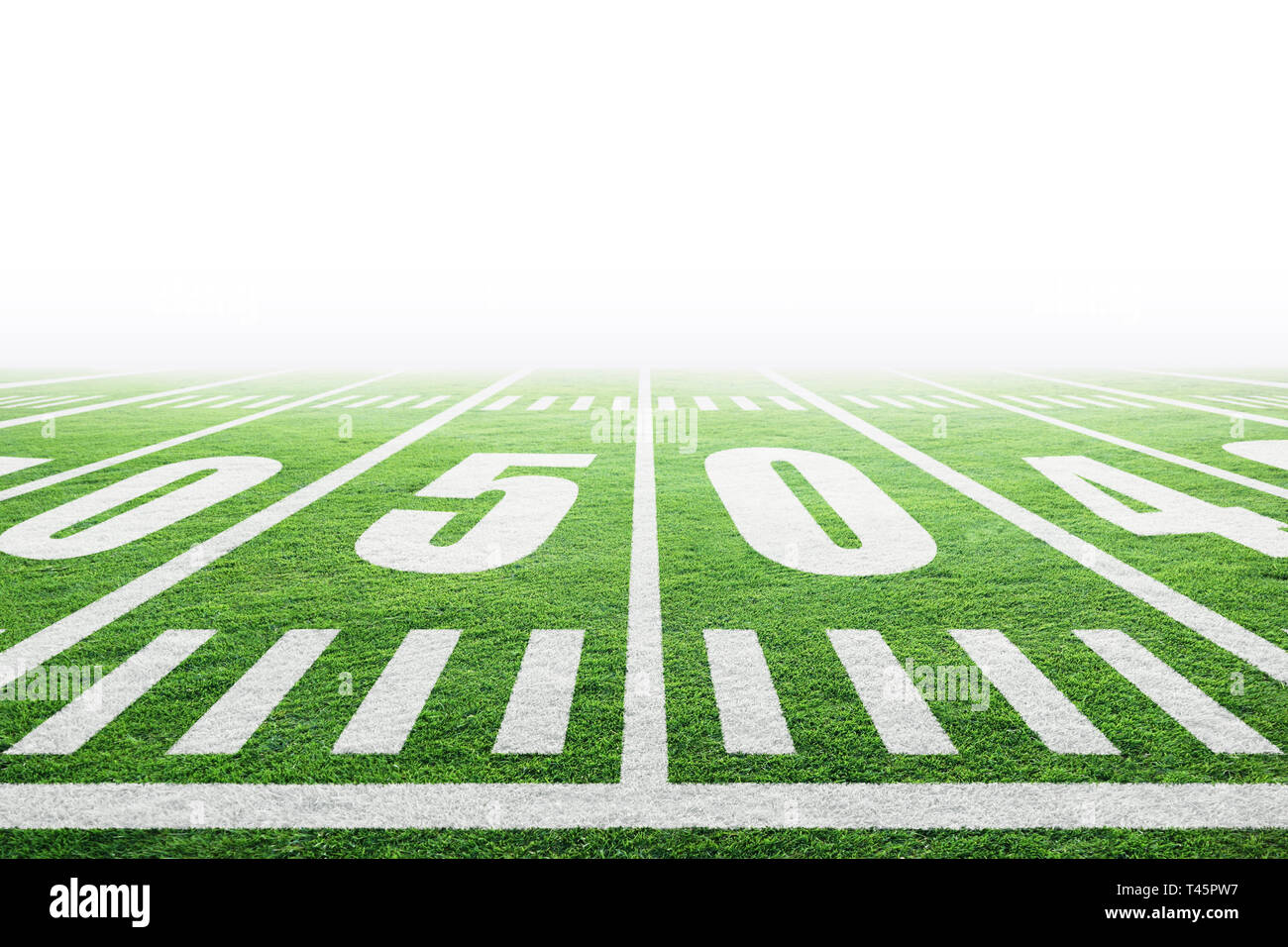 Close up of American football stadium field with yard line markings and white background for copy space. Stock Photo