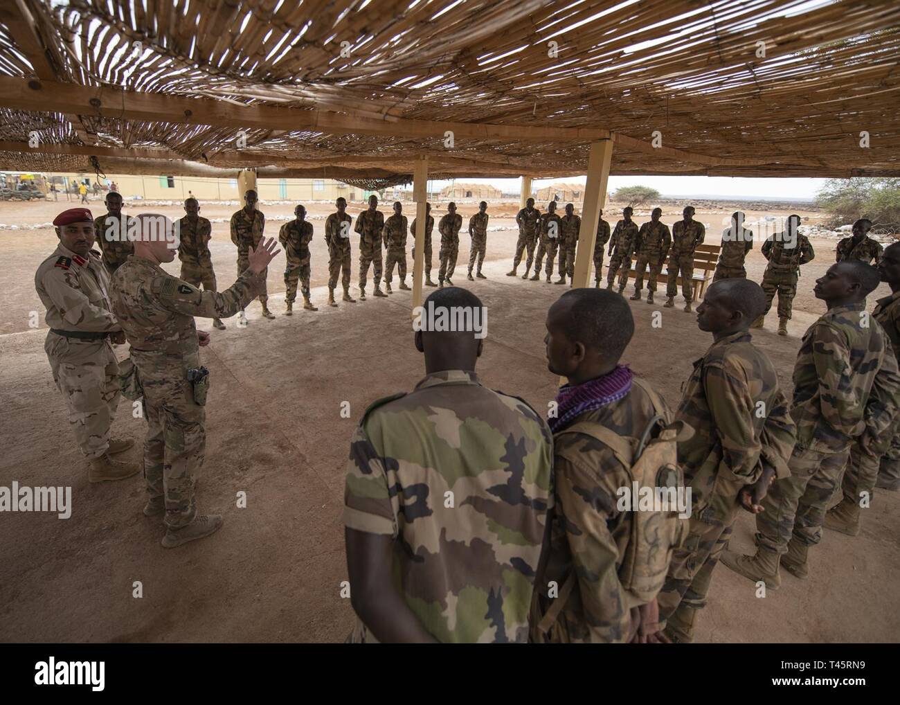 U.S. Army Capt. Joseph Brunone, the commander of Headquarters Company, 1-141 Infantry Regiment, Task Force Alamo, Texas National Guard, assigned to Combined Joint Task Force-Horn of Africa, gives opening remarks during an infantry skills course graduation for Rapid Intervention Battalion (RIB) soldiers from the Djiboutian army’s elite military force at a training location near Djibouti, March 7, 2019. Task Force Alamo Soldiers provided the training to the RIB soldiers. Stock Photo