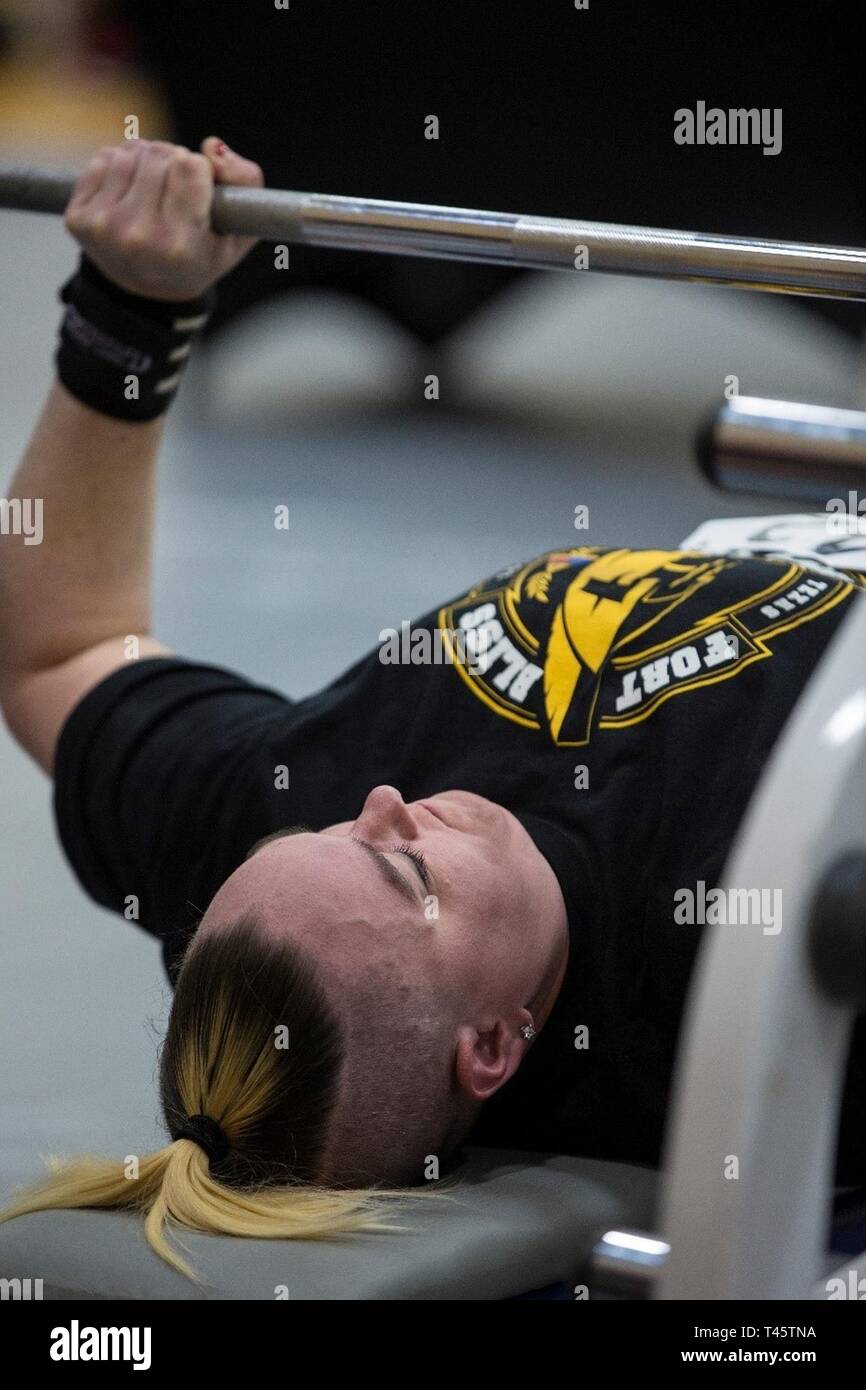 Retired Spc. Erin Holmes, a wounded warrior athlete from Fort Riley, Kansas attempts a lift during the Powerlifting competition at the 2019 Army Trials at Fort Bliss, Texas. Army Trials is an adaptive-sports competition taking place from March 5 - 16 with nearly 100 wounded, ill and injured active-duty Soldiers and veterans competing in 14 different adaptive sports for the opportunity to represent Team Army at the 2019 Department of Defense Warrior Games in Tampa, Florida. U.S. Army Stock Photo