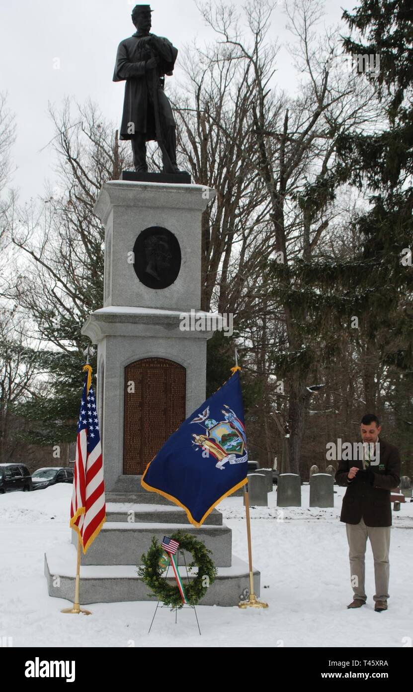 Brig. Gen. John Andonie, the Director of Joint Staff for the New York National Guard and a former commander of the  1st Battalion 69th Infantry, reads the poem 'Rouge Bouquet' , a World War I poem about the death of 69th Infantry Soldiers, during a memorial service held to recognize Civil War veterans who served in the Irish Brigade and the 69th Infantry at the Soldiers Lot in Albany Rural Cemetery on March 10, 2019. Veterans of the New York National Guard's 1st  Battalion 69th Infantry who live in the Albany, N.Y.- area marked the graves of Irish-American Civil War Soldiers at Albany Rural Ce Stock Photo