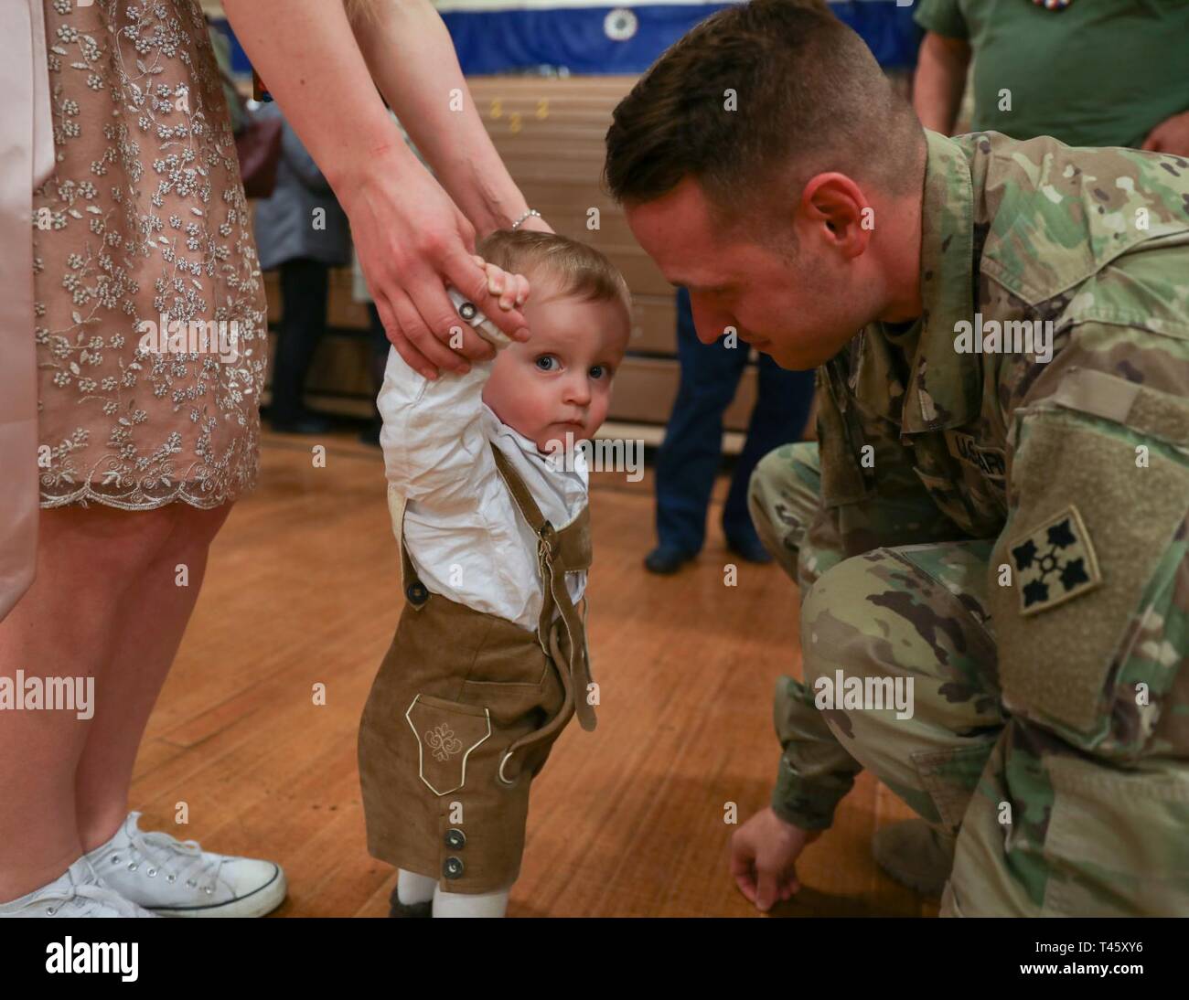 Spc. Troy Peterson interacts with his son, 1yearold Elias, following