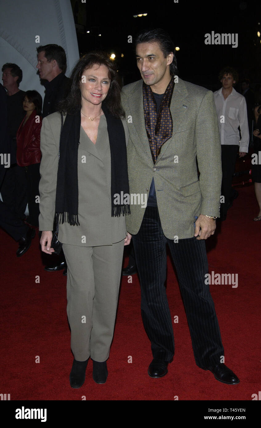 LOS ANGELES, CA. March 18, 2003: Actress JACQUELINE BISSET & boyfriend EMIN BOZTEPE at the General Motors 'ten' - Cars, Stars and Oscars party in Hollywood. © Paul Smith / Featureflash Stock Photo