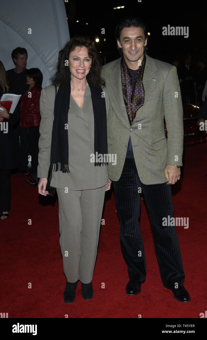 LOS ANGELES, CA. March 18, 2003: Actress JACQUELINE BISSET & boyfriend EMIN BOZTEPE at the General Motors 'ten' - Cars, Stars and Oscars party in Hollywood. © Paul Smith / Featureflash Stock Photo