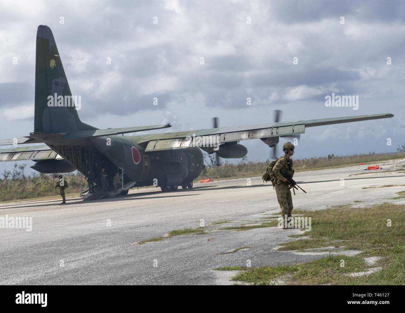 Royal Australian Air Force security force members provide security on the flight line at Tinian, U.S. Commonwealth of the Northern Marianas Islands during Cope North Feb. 19, 2019. Cope North is an annual multilateral U.S. Pacific Air Forces-sponsored field training exercise focused on combat air forces large-force employment and mobility air forces humanitarian assistance and disaster relief training to enhance interoperability among U.S., Australian and Japanese forces. Stock Photo